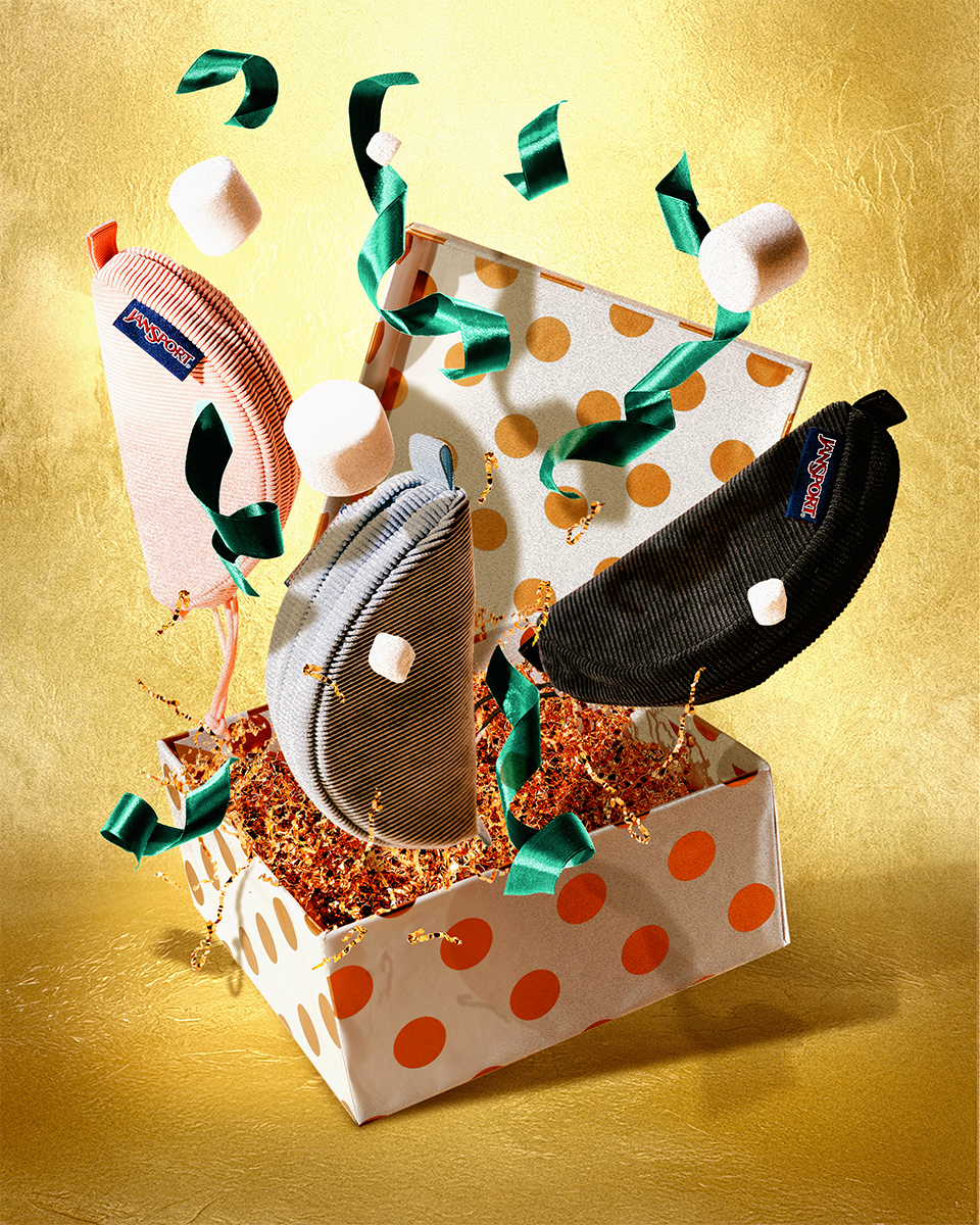 Three Jansport Lunar Pouches on a gold background